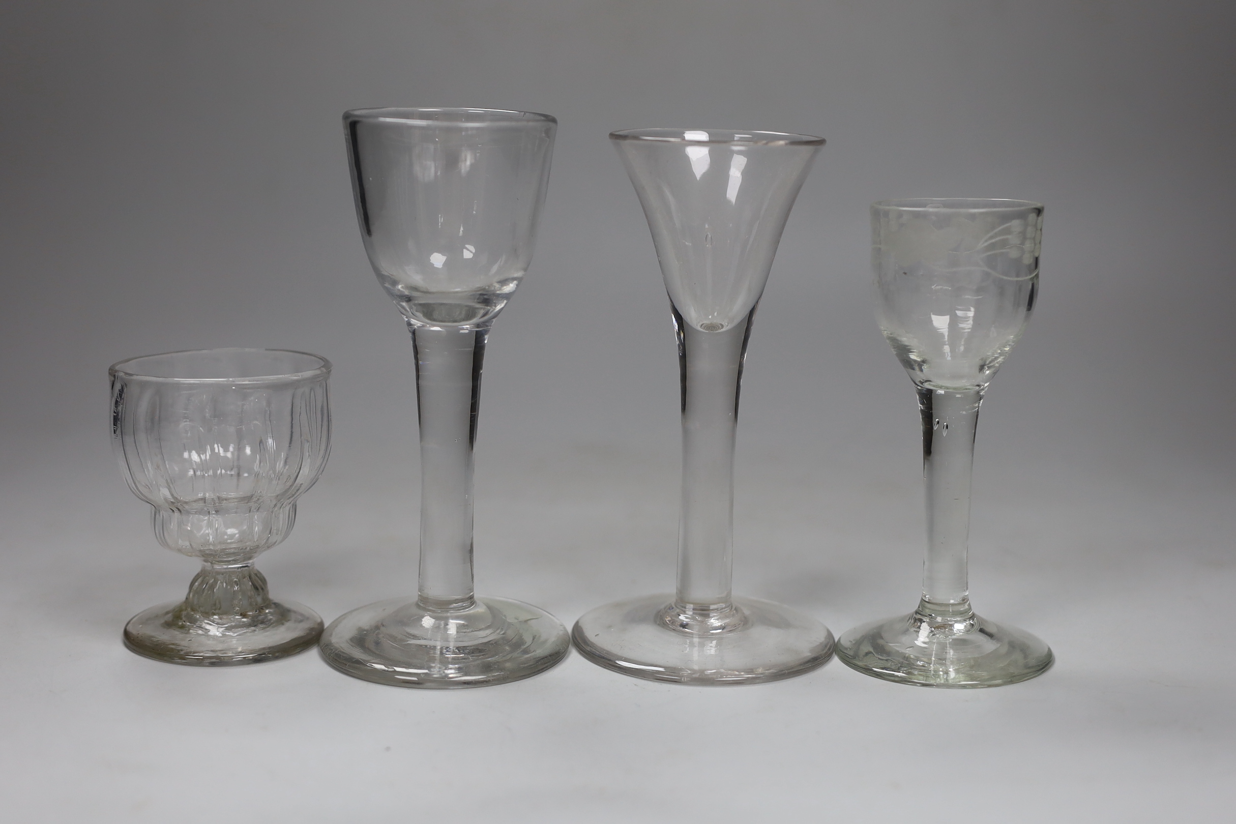 Two George II cordial glasses, a syllabub cup and another cordial glass, tallest 15cm high (4)